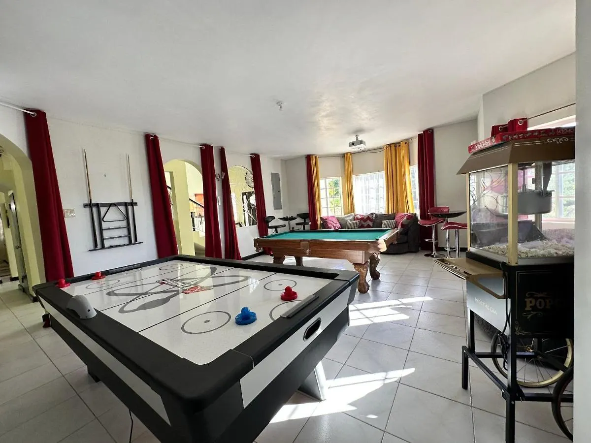 A Luxurious 4-Bedroom Private Villa With Games Room, Theatre & Modern Art Montego Bay