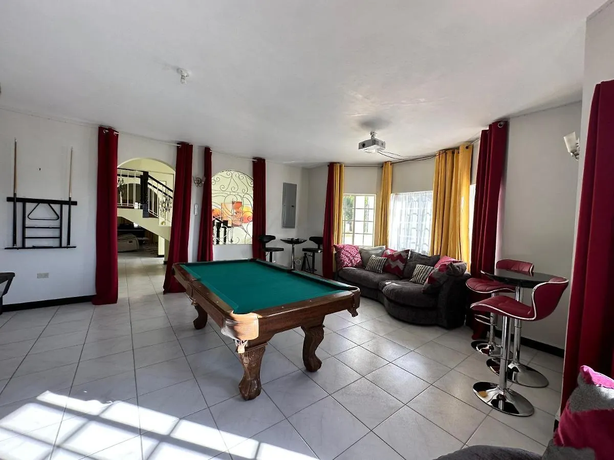 A Luxurious 4-Bedroom Private Villa With Games Room, Theatre & Modern Art Montego Bay